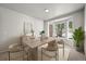 Bright dining room features a bay window, modern table, and sleek decor for an inviting atmosphere at 2732 Flint Ct, Superior, CO 80027