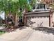 Charming two-story home with a brick facade, attached garage, and mature trees at 2732 Flint Ct, Superior, CO 80027