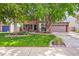 Beautiful two-story brick home with mature landscaping, lush green lawn, and a two-car garage at 2732 Flint Ct, Superior, CO 80027