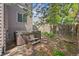 A secluded backyard featuring a hot tub, surrounded by landscaping and a wooden privacy fence at 2732 Flint Ct, Superior, CO 80027