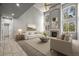 Bright living room boasts soaring ceilings, fireplace, and large windows offering plenty of natural light at 2732 Flint Ct, Superior, CO 80027