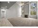 Bright living room boasts soaring ceilings, fireplace, and large windows offering plenty of natural light at 2732 Flint Ct, Superior, CO 80027