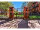 Brick entrance to the gated community, featuring iron fence and arched brick entrance at 1356 N Pearl St # 202, Denver, CO 80203