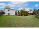 Well-maintained backyard with a large lawn, mature landscaping, and privacy fencing at 13388 Alcott Cir, Broomfield, CO 80020