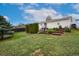 A sprawling backyard featuring lush grass, mature trees, and tiered landscaping at 13388 Alcott Cir, Broomfield, CO 80020
