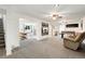 Open basement with a TV, foosball table, and seating area offers a versatile entertainment space at 13388 Alcott Cir, Broomfield, CO 80020