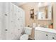 Cozy bathroom featuring white floral curtain, mirror, and sink provide a relaxing and comfortable space at 13388 Alcott Cir, Broomfield, CO 80020