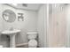 Bright bathroom featuring a stand-up shower, and a pedestal sink offer a refreshing space at 13388 Alcott Cir, Broomfield, CO 80020