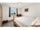 Bright bedroom featuring a window, wooden bed frame and gray carpet floor offer a great space at 13388 Alcott Cir, Broomfield, CO 80020