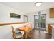 Cozy breakfast nook with a round table, offering a pleasant view through glass doors to the outside at 13388 Alcott Cir, Broomfield, CO 80020