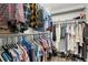 Large walk-in closet with hanging racks and rows of shoes provide ample storage space at 13388 Alcott Cir, Broomfield, CO 80020