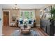Open concept dining room with hardwood floors and natural lighting at 2271 Holly St, Denver, CO 80207