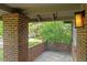 Relaxing front porch with brick columns, offering a peaceful outdoor space at 2271 Holly St, Denver, CO 80207