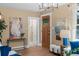 Bright living room with beautiful front door and hardwood floors at 2271 Holly St, Denver, CO 80207