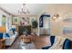 Cozy living room with a fireplace, hardwood floors and archway entrance to dining room at 2271 Holly St, Denver, CO 80207