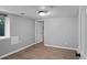 Neutral room with hardwood floors and a walk-in closet, ideal for an office or bedroom at 2271 Holly St, Denver, CO 80207