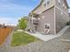 Landscaped backyard featuring a patio and stairs at 4552 S Perth Ct, Aurora, CO 80015