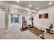 Spacious basement area with exercise equipment and sliding door to backyard at 4552 S Perth Ct, Aurora, CO 80015