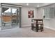 Finished basement area featuring a sliding glass door at 4552 S Perth Ct, Aurora, CO 80015
