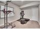 Finished basement area featuring workout space with equipment at 4552 S Perth Ct, Aurora, CO 80015