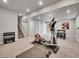 Carpeted basement with workout space and stairs at 4552 S Perth Ct, Aurora, CO 80015
