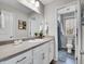 Clean bathroom featuring a double sink vanity and modern decor at 4552 S Perth Ct, Aurora, CO 80015