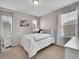 Inviting bedroom featuring a cozy bed and ample natural light at 4552 S Perth Ct, Aurora, CO 80015