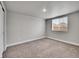 Carpeted bedroom with a window at 4552 S Perth Ct, Aurora, CO 80015
