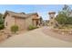 Community clubhouse with stone accents, manicured landscaping, and a porte-cochere at 4552 S Perth Ct, Aurora, CO 80015