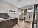 Bright home office with a large desk, comfortable seating, and plenty of natural light at 4552 S Perth Ct, Aurora, CO 80015