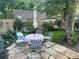 Charming backyard patio area with stone pavers, outdoor seating and lush greenery at 636 York St, Denver, CO 80206