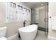 Modern bathroom with a free-standing tub and walk-in shower at 636 York St, Denver, CO 80206