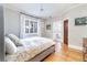 Bright bedroom with hardwood floors and ensuite bathroom at 636 York St, Denver, CO 80206