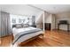 Bright bedroom with wood floors and large windows at 636 York St, Denver, CO 80206