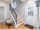 Bright entryway with hardwood floors and staircase at 636 York St, Denver, CO 80206