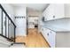 Open concept kitchen with white cabinets and marble countertops at 636 York St, Denver, CO 80206