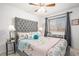 Bright bedroom with a comfortable bed and charming decor at 15776 E 107Th Way, Commerce City, CO 80022