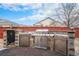 Built-in stainless steel outdoor kitchen with a stone surround and a custom BBQ at 15776 E 107Th Way, Commerce City, CO 80022