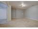 Basement room featuring carpet flooring, neutral walls, and ample space for various uses at 265 Cleveland Ct, Bennett, CO 80102