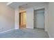 Clean and well-lit bedroom with neutral walls, a closet, and carpet flooring at 265 Cleveland Ct, Bennett, CO 80102