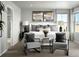 Inviting bedroom with neutral tones, accent chairs, and a large window offering natural light at 249 E 4Th St, Berthoud, CO 80513