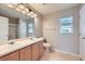 Well-lit bathroom featuring a double sink vanity, and a shower-tub combination at 5653 Raleigh Cir, Castle Rock, CO 80104