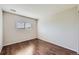 Bedroom featuring wood floors, a window and neutral walls at 5653 Raleigh Cir, Castle Rock, CO 80104