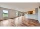 Spacious living room featuring hardwood floors, ample natural light from windows, and an open layout at 5653 Raleigh Cir, Castle Rock, CO 80104