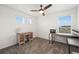 Spare bedroom or home office, carpeted with a ceiling fan and a desk next to the window at 9590 Sedalia St, Commerce City, CO 80022