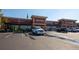 A vibrant commercial building offers a variety of services, including dining, dental care, and liquor at 9590 Sedalia St, Commerce City, CO 80022