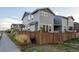 Charming exterior view of the home, showcasing the well-maintained yard and surrounding neighborhood at 9590 Sedalia St, Commerce City, CO 80022
