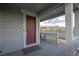 Inviting front porch with a seating area, offering a cozy outdoor space at 9590 Sedalia St, Commerce City, CO 80022