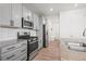 Well-equipped kitchen showcasing stainless steel appliances, granite countertops, and ample cabinet space at 9590 Sedalia St, Commerce City, CO 80022