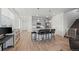 Modern kitchen featuring a center island with bar seating and stainless steel appliances at 9590 Sedalia St, Commerce City, CO 80022